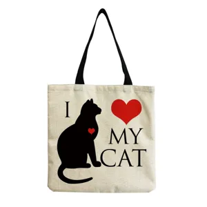 Canvas tote shoulder bag detail view featuring cute black cat graphic and red heart print.