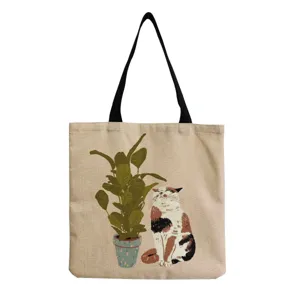 Close-up detail of the cute cat and plant print on the canvas tote bag fabric texture.