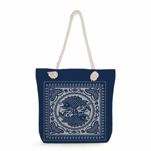 Detail view of the blue canvas tote bag with traditional Chinese fish pattern and rope handles.