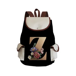 Close-up of canvas backpack featuring a decorative floral letter Z print and side pockets.