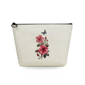 Canvas cosmetic bag detail view, vintage floral print makeup pouch with black zipper closure.