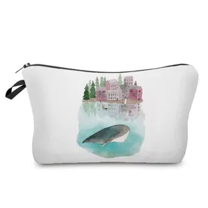 Detail view of a portable cosmetic makeup bag featuring a cute watercolor whale and town print.
