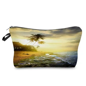 Detailed view of the cosmetic storage bag featuring a scenic sunset beach print and zipper.