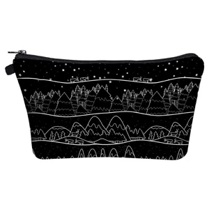 Closeup detail of the black makeup pouch featuring a charming white starry night forest pattern.