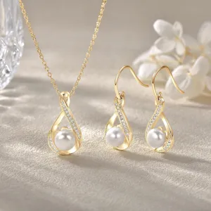 Elegant 14K gold plated pearl necklace and earrings set, perfect for bridal wedding jewelry.