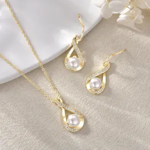 Detail shot of 14k gold plated pearl necklace and earrings bridal wedding jewelry set.
