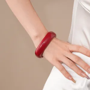 Glossy red acrylic bangle bracelet, minimalist chunky resin jewelry for women daily wear.