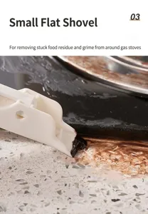 Detail shot of flat scraper removing thick grime from kitchen stove edges