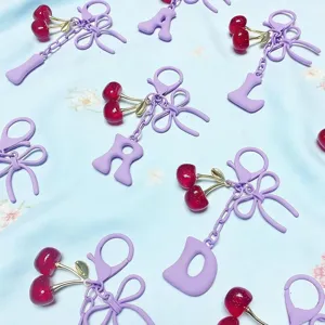 Cute purple cherry letter keychain charm, sweet aesthetic bag accessory for women and car keys.