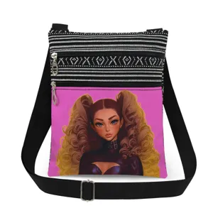 Detailed view of the crossbody bag featuring black white stripes and pink girl print pocket.