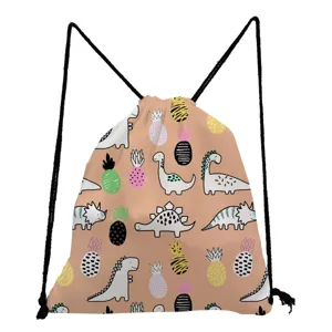 Close-up detail of cute cartoon dinosaur and pineapple print pink drawstring backpack.