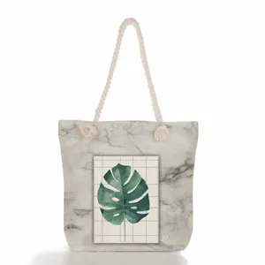 Grand sac cabas en toile pour femme avec motif marbre et imprime de feuille de monstera.