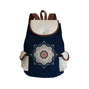 Detailed view of the Chinese style floral printed canvas backpack with contrast pockets.