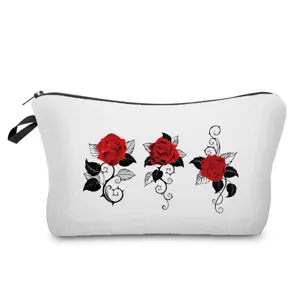 Detailed view of cosmetic bag with red rose print, showing clear fabric and smooth black zipper.
