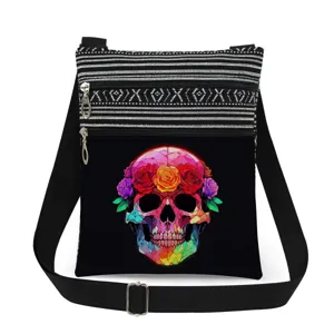 Detailed view of the stylish crossbody bag with vibrant floral skull print and striped top.