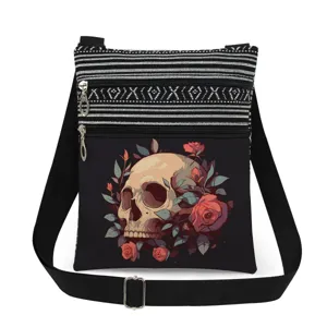 Detailed view of skull and rose print crossbody messenger bag with black and white striped top.