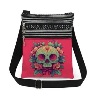 Detailed view of the canvas crossbody bag featuring a vibrant sugar skull print and stripes.