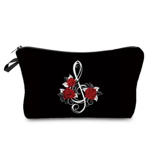 Detailed view of a black cosmetic bag featuring a white treble clef and red rose print, zipper.