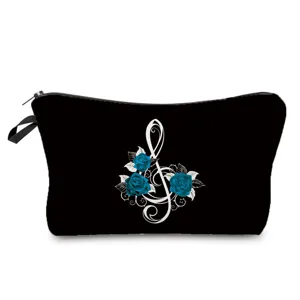 Detail view of black makeup pouch featuring elegant blue roses and treble clef pattern.