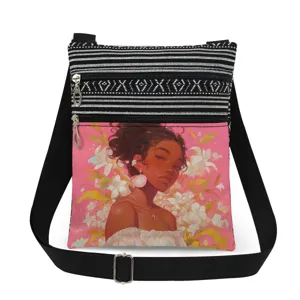 Detail view of the stylish canvas crossbody bag featuring black white stripes and floral print.