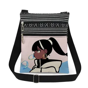 Canvas cross-body bag with cartoon girl print, double zippers, and adjustable black shoulder strap.