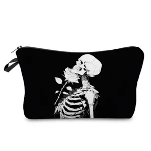 Close-up detail view of the gothic black cosmetic pouch featuring artistic skeleton and rose print.