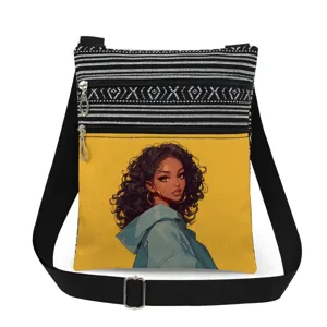 Close-up detail of the canvas shoulder bag featuring a stylish cartoon girl print and zippers.