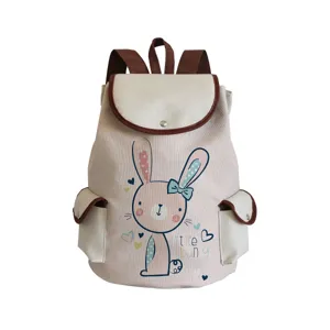 Canvas school backpack detail showcasing cute bunny cartoon print and brown trim.