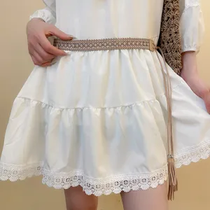 Ethnic style woven belt with delicate tassels and intricate braided texture for versatile chic outfits.