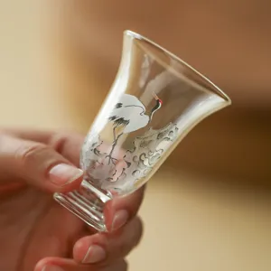Handcrafted clear glass tea cup with traditional crane pattern for home office tea set