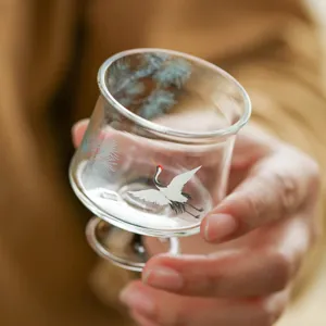 Exquisite high foot glass tea cup with elegant pine and crane pattern for kung fu tea.