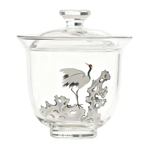 Clear glass gaiwan tea cup with elegant white crane and rock painting motif for home kung fu tea.