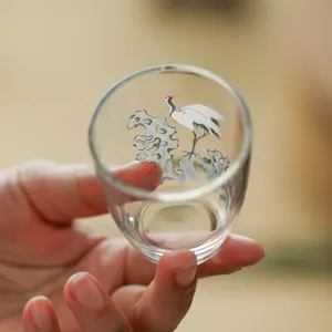 Handgemachte Teetasse aus Glas mit elegantem Kranich-Design, ideal für Kung-Fu-Tee-Genuss.