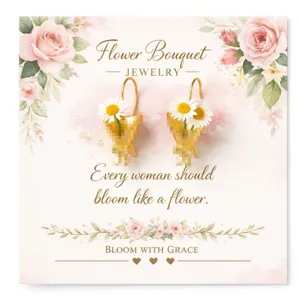 Eleganti orecchini pendenti a bouquet di margherite dorate su carta con stampa floreale.