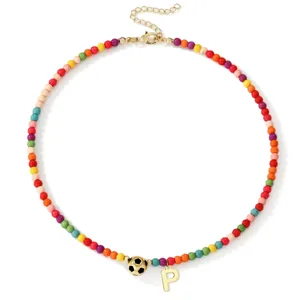 Colorful beaded collarbone necklace with soccer ball charm and letter P pendant for women.