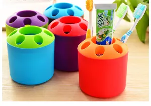 Close-up detail of colorful portable toothbrush holders organizing toothbrushes and toothpaste