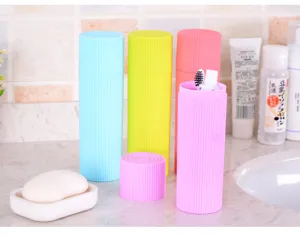 Detail of colorful portable travel toothbrush case sets on a bathroom counter