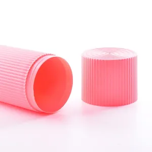 Portable pink travel toothbrush case with textured ribbed design shown on white backdrop