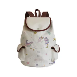 Detailed view of canvas backpack with cute unicorn print, brown straps, and magical text.