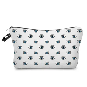 Vista dettagliata borsa cosmetica con motivo occhi blu, pochette con zip per articoli da toeletta.