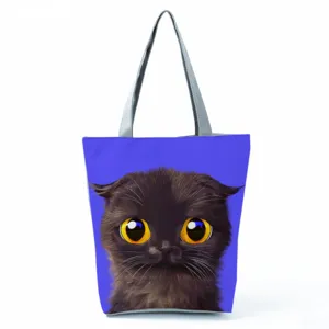 Sac à bandoulière en toile pour femme avec motif de chat mignon, fourre-tout stylé.