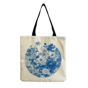 Detailed close-up view of blue and white porcelain floral pattern print on the canvas tote bag.