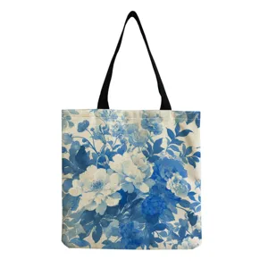 Blue floral print canvas tote bag detail view, vintage porcelain style shoulder bag design.