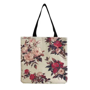 Close-up detail of the vintage red rose floral print canvas tote bag fabric texture.