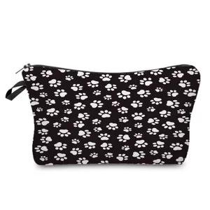 Close-up view of the cute black and white paw print pattern and smooth zipper detail.
