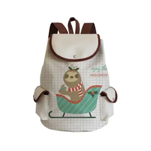 Canvas backpack detail with cute Christmas sloth print, brown leather trim and spacious pockets.