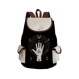 Close-up view of the mystical eye print and canvas pocket details on the stylish canvas backpack.