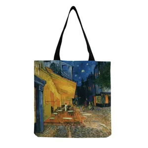 Vue détaillée du cabas en toile avec impression de peinture à l'huile et anses noires.