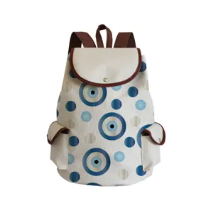 Canvas backpack with evil eye print, casual large capacity student school bag, stylish daypack.