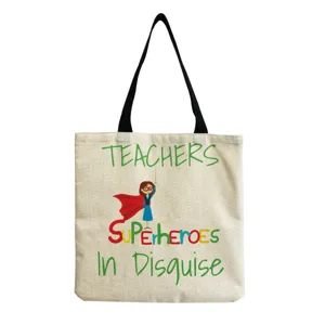Leinwand Tragetasche Detail mit kreativem Lehrern Superhelden Druck und stabilen schwarzen Henkeln.